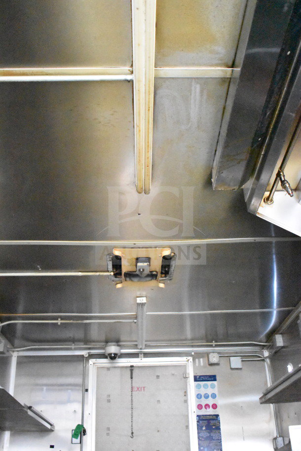 2019 Diamond Cargo 8.5'x24' food trailer interior with grease hood, suppression system, and stainless steel finish. VIN: 53NBE2426L1076066.