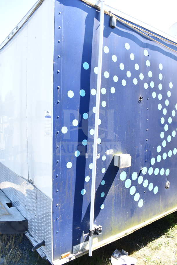 2019 Diamond Cargo 8.5'x24' food trailer with grease hood, refrigeration, and fryer; visible markings on blue exterior.