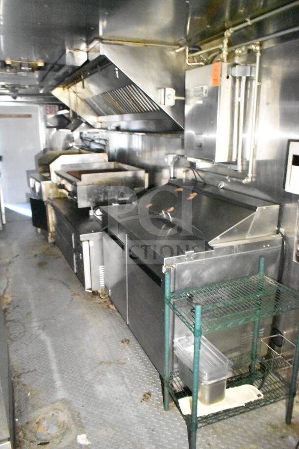 2020 LGS TX 8.5'x24' food trailer with CaptiveAire grease hood, suppression system, refrigeration, and griddle.