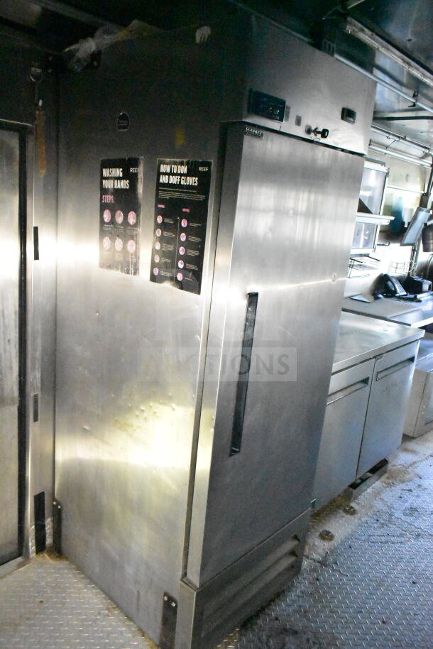 2020 LGS TX 8.5'x24' food trailer interior with stainless steel refrigeration and equipment. Visible signs on hygiene practices.
