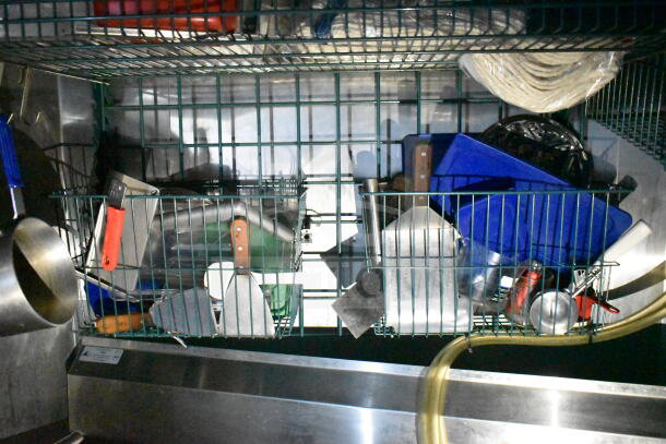 Interior storage of 2020 LGS TX food trailer, including pots, utensils, and cookware on wire shelves.
