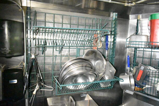 2020 LGS TX 8.5'x24' food trailer interior with CaptiveAire grease hood, stainless steel rack holding cookware and utensils.
