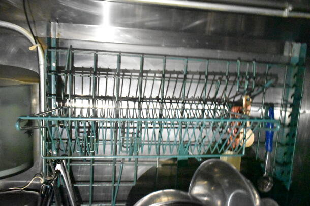 Interior view of a 2020 LGS TX food trailer showing metal racks and kitchen equipment. Clean and well-maintained condition.