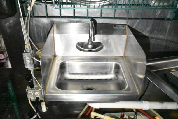 Stainless steel sink in 2020 LGS TX food trailer, featuring a faucet and visible plumbing fittings. Good condition.