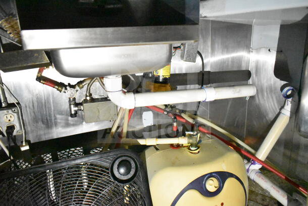 2020 LGS TX 8.5'x24' food trailer with plumbing and electrical components visible, part of CaptiveAire hood system.