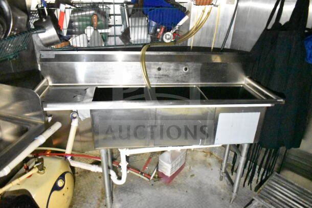 2020 LGS TX 8.5'x24' food trailer interior, featuring stainless steel triple sink, plumbing, and storage area.