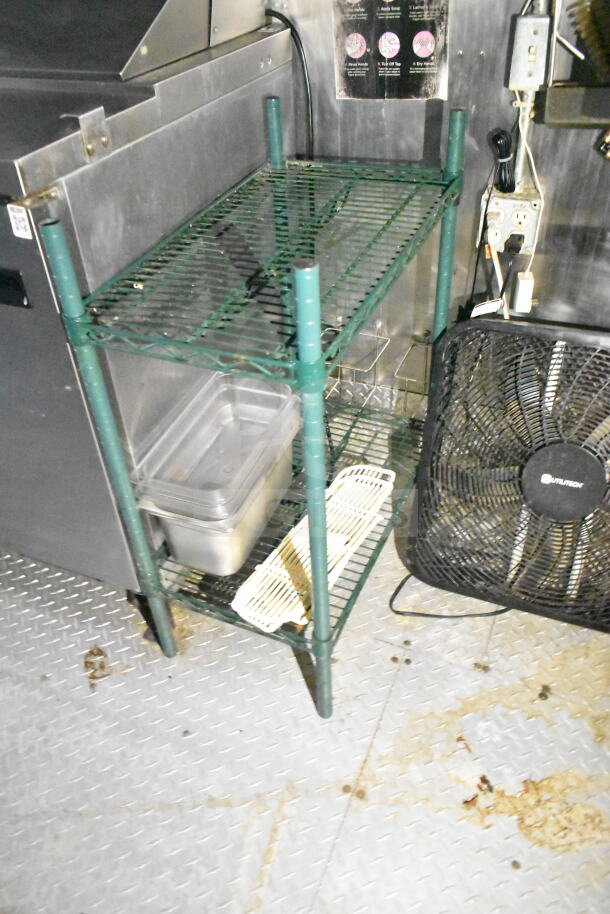 2020 LGS TX 8.5'x24' food trailer interior showing shelving, ventilation, and fan. Equipped with CaptiveAire system.