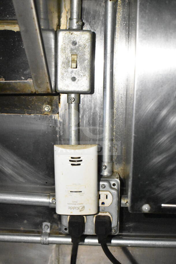 Interior detail of 2020 LGS TX food trailer showing electrical switch and Kidde carbon monoxide alarm.