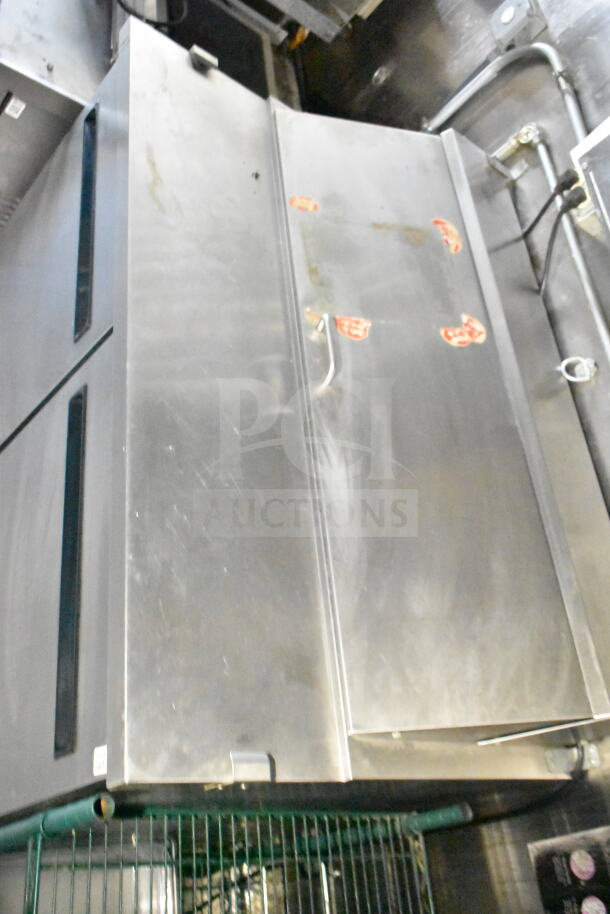 2020 LGS TX 8.5'x24' food trailer interior, showing CaptiveAire grease hood. Stainless steel finish, used condition.