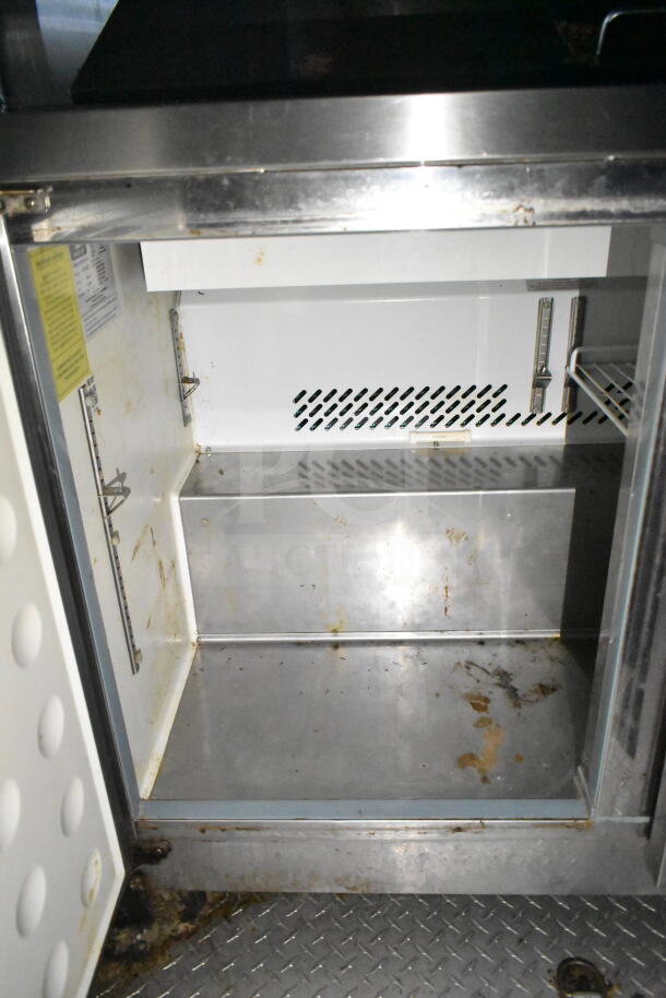 2020 LGS TX 8.5'x24' food trailer interior showing refrigeration and CaptiveAire system with mild wear.