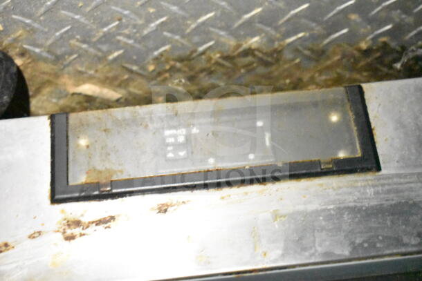 Control panel inside a 2020 LGS TX 8.5'x24' food trailer, showing wear and some dirt accumulation.