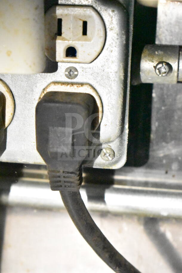Electrical outlet and plug inside a 2020 LGS TX 8.5'x24' food trailer, showing internal wiring condition.