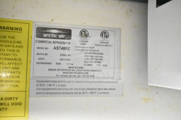 Label on Arctic Air AST48RZ commercial refrigerator; details include model, batch, refrigerant type, and design pressures.
