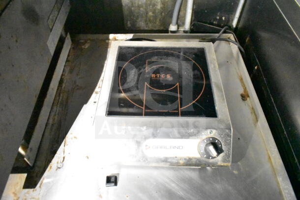 Garland induction cooktop in 2020 LGS TX food trailer; visible wear, RTCS logo.