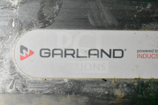 Label of a Garland appliance, showing branding and slight wear, part of a 2020 LGS TX 8.5'x24' food trailer setup.