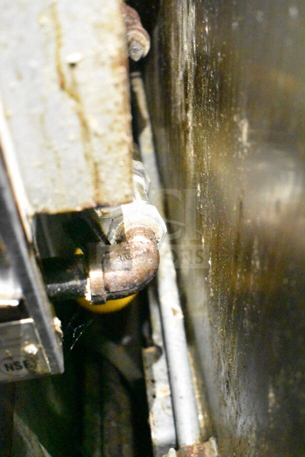 2020 LGS TX food trailer interior showing grease hood connections, visible piping, and metal surfaces.