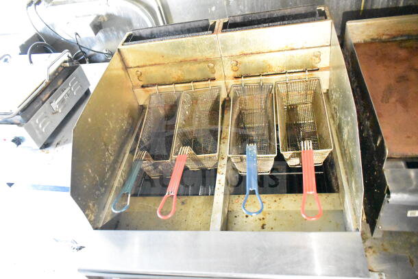 2020 LGS TX 8.5'x24' food trailer fryers with multiple baskets, equipped for commercial use, shows signs of wear.