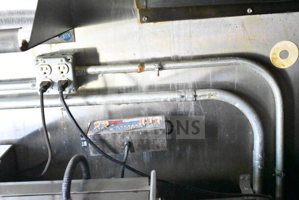 2020 LGS TX food trailer interior showing electrical outlet and wiring, part of CaptiveAire system in used condition.