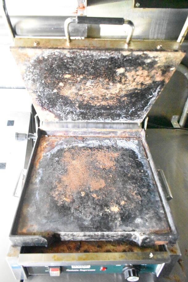 2020 LGS TX food trailer griddle, shows heavy use with visible residue. Part of full kitchen setup including grease hood.