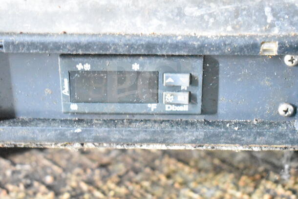 Dixell temperature controller on 2020 LGS TX food trailer, showing temperature settings. Dust visible on surface.