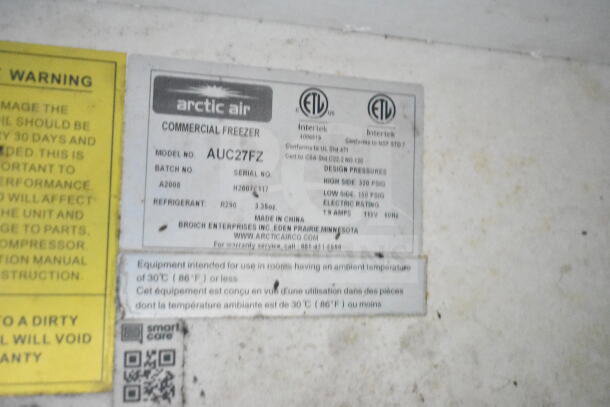2020 LGS TX 8.5'x24' food trailer label displaying Arctic Air freezer model AUC27FZ, serial H2007F117, with refrigerant R290.