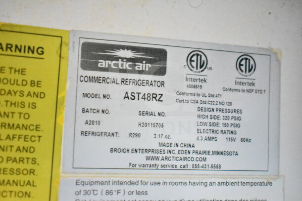 Arctic Air commercial refrigerator label, Model AST48RZ, refrigerant R290, design pressures, and electric rating details.
