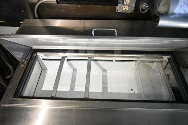 2020 LGS TX 8.5'x24' food trailer interior showing refrigeration unit with compartments, minor wear visible.