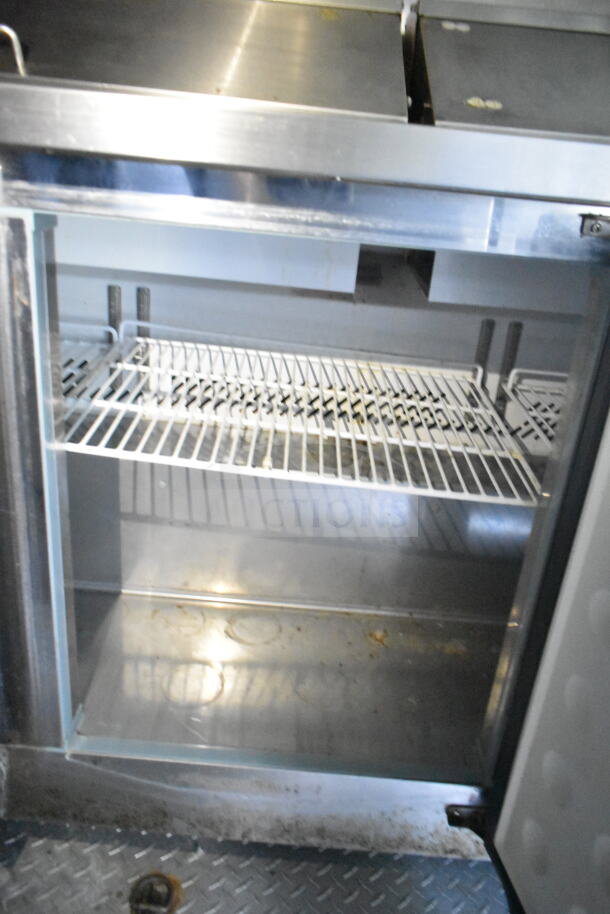 2020 LGS TX 8.5'x24' Food Trailer interior showing refrigeration unit, CaptiveAire grease hood, clean condition.