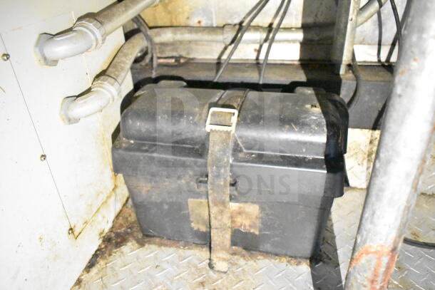 Interior view of a 2020 LGS TX food trailer, showing grease hood and electrical wiring in used condition.