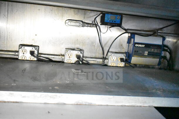 2020 LGS TX 8.5'x24' food trailer interior, showing electrical outlets and Guest charger. Includes CaptiveAire grease hood.