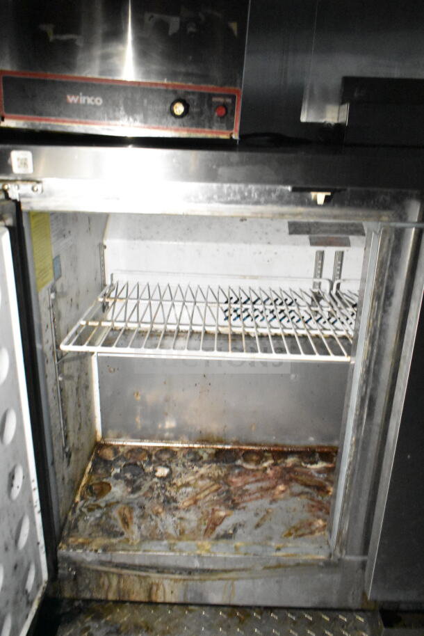 2020 LGS TX 8.5'x24' food trailer interior showing Winco refrigeration, shelving, and signs of wear and rust.