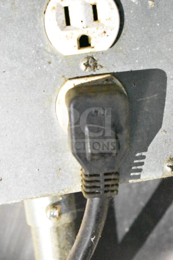 Alt text: Power outlet and plug inside 2020 LGS TX food trailer, detail shown for connectivity and condition verification.