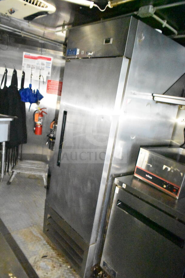 2020 LGS TX 8.5'x24' food trailer interior with refrigeration, CaptiveAire grease hood, suppression system, and griddle.