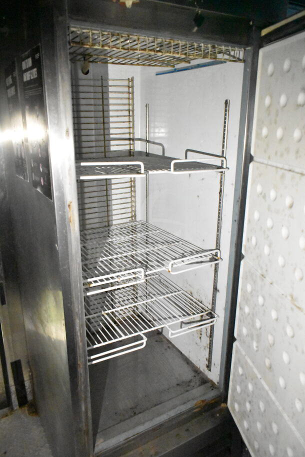 2020 LGS TX 8.5'x24' food trailer interior with shelving, refrigeration unit. Features CaptiveAire grease hood.