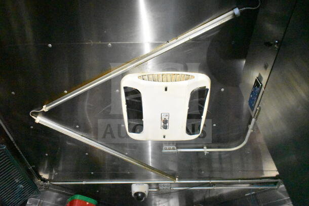 2020 LGS TX 8.5'x24' food trailer ceiling showing CaptiveAire grease hood and suppression system in stainless steel interior.