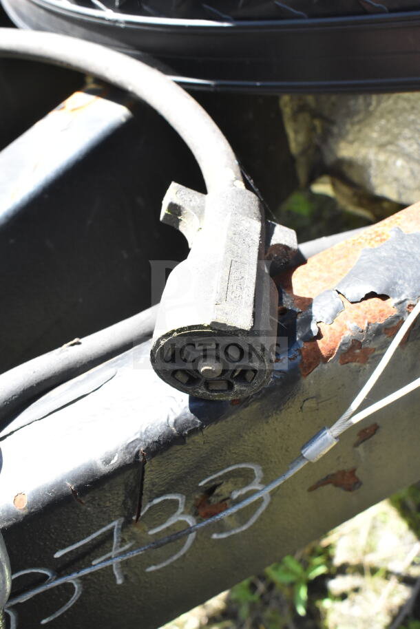 2020 LGS TX food trailer connector detail, showing black plug on rusted frame with VIN partially visible at bottom.