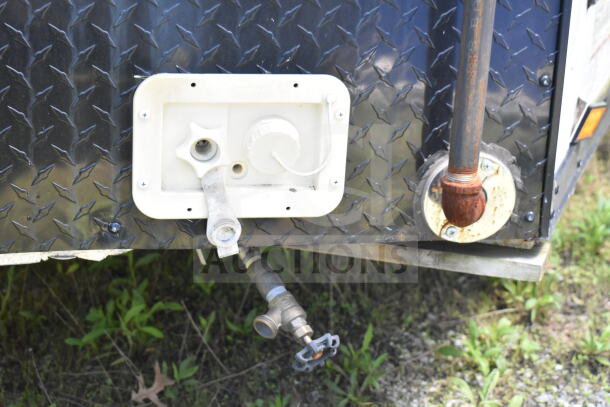 Exterior detail of 2020 LGS TX 8.5'x24' food trailer with visible water and gas connections on diamond plate surface.