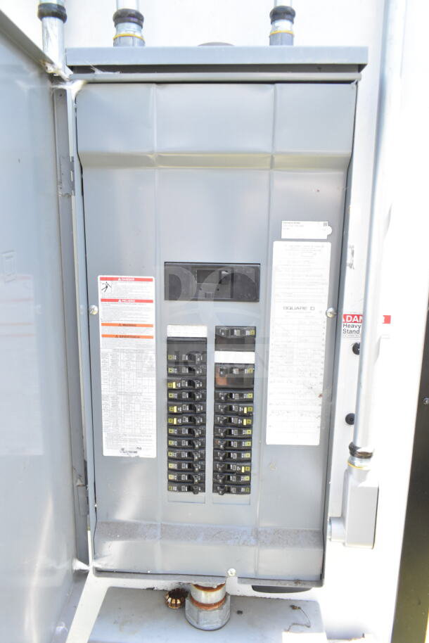 Electrical panel inside the 2020 LGS TX 8.5'x24' food trailer, featuring labeled circuit breakers and warning labels.