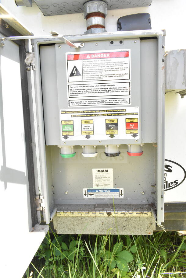 Electrical panel inside 2020 LGS TX 8.5'x24' food trailer. Includes safety warnings, connection instructions, and ROAM notice.