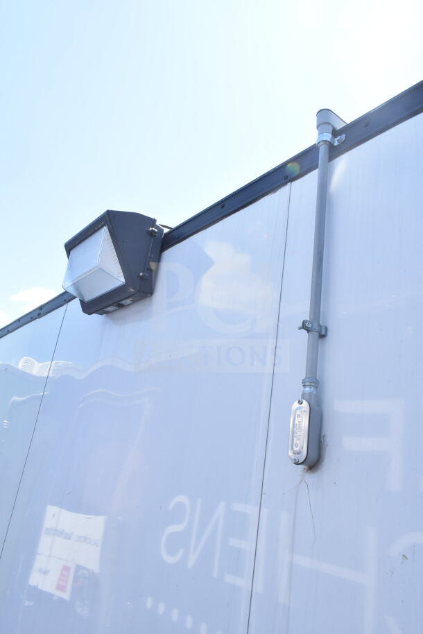 2020 LGS TX 8.5'x24' food trailer exterior with mounted light. Features CaptiveAire grease hood, suppression system.