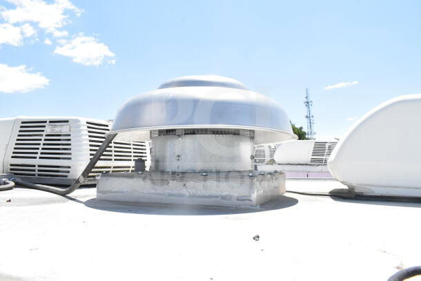 Rooftop view of 2020 LGS TX food trailer featuring CaptiveAire grease hood. Clear sky background, metal vent center.