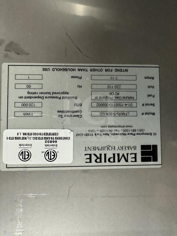 Empire Bakery Deck Oven Model LFM-5-80X100 label. Shows specs like fuel type, voltage, and ETL certifications. Serial: 014150011100009002.