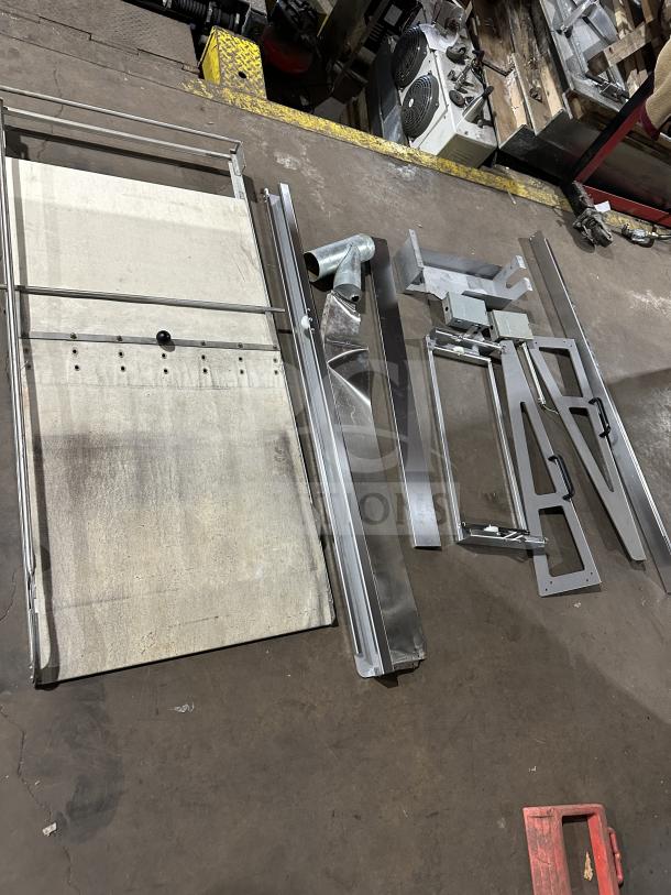 Empire LFM-5-80X100 bakery deck oven components, unassembled. Stainless steel parts, stone hearth surface visible.