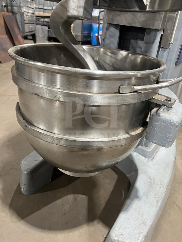 Hobart HL661 blue electric bench mixer with stainless steel bowl guard and mixing bowl in good condition, on legs.