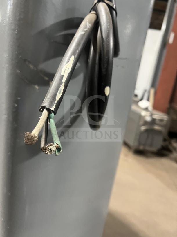 Hobart HL661 bench mixer with exposed electrical cables. Stainless steel bowl guard and mixing bowl not visible. Model details labeled.