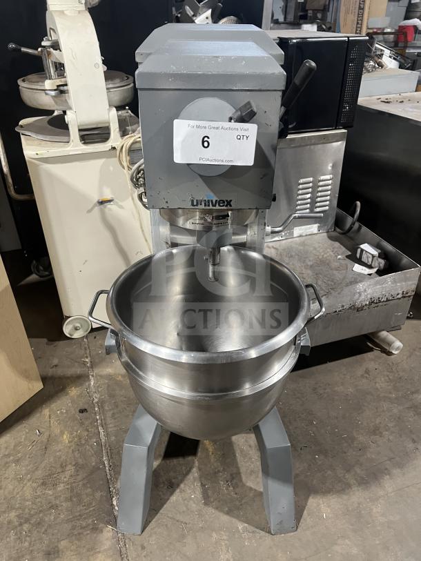 Univex floor-style planetary mixer with stainless steel mixing bowl, gray finish, on legs, appears in good condition.