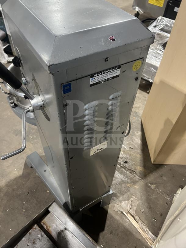 Univex planetary mixer with stainless steel bowl, on legs. Features OSHA compliance and UL markings. Visible wear.