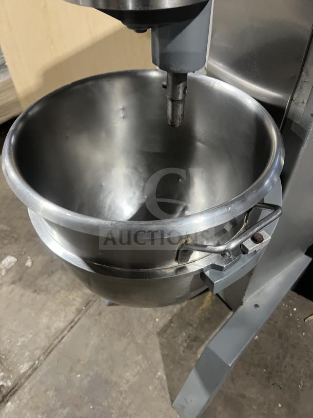 Univex planetary mixer with stainless steel bowl on sturdy legs, showing minimal wear, ideal for commercial use.