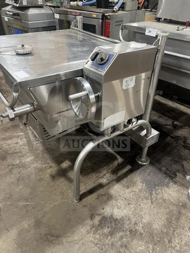 Commercial stainless steel tilting skillet, on sturdy legs, with temperature control dial, in good used condition.