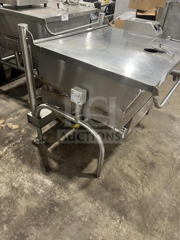 Commercial stainless steel braising pan with tilting skillet, on sturdy legs. Good condition, suitable for industrial kitchens.